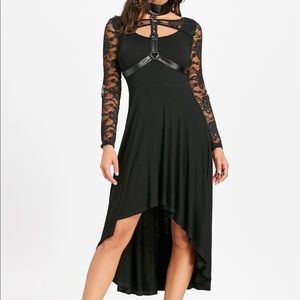 Dip hem open back dress with choker.